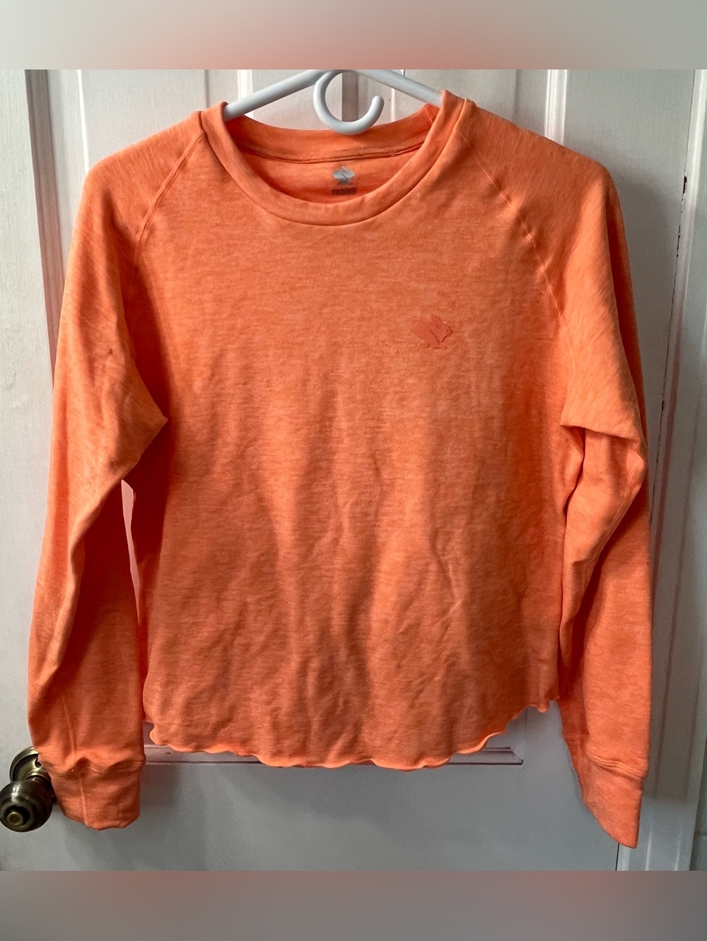 rabbit Women's EZ Tee Perf Long Sleeve in the colorway "Spicy Orange". Size SM